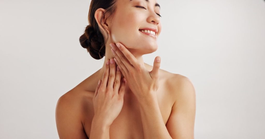Woman with smooth, glowing skin after dermaplaning at SkinScience Clinic Calgary - SkinScience Woman with smooth, glowing skin after dermaplaning at SkinScience Clinic Calgary - SkinScience